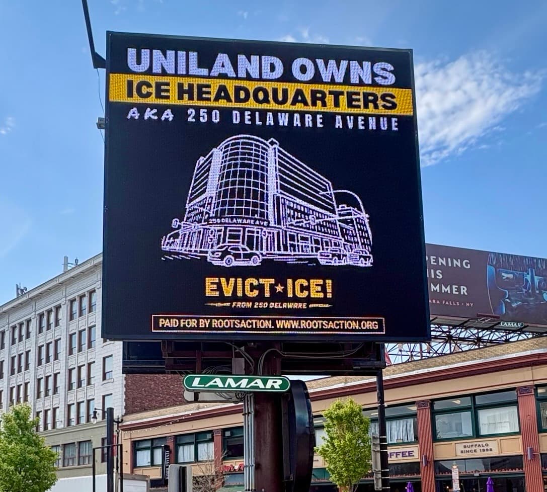 Billboard reading 'Uniland owns ICE headquarters — Evict ICE!'